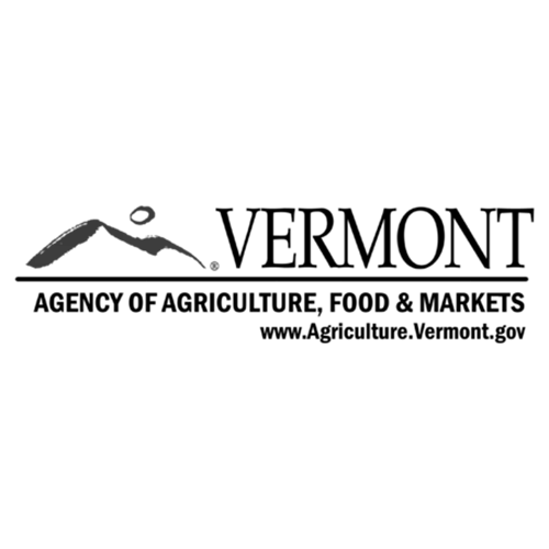 A stylized bird figure above a mountain silhouette.