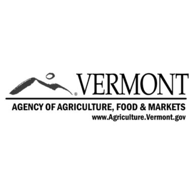 A stylized bird figure above a mountain silhouette.